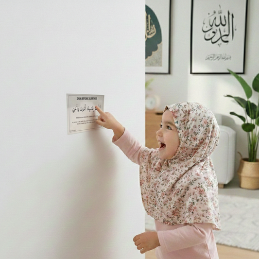 Child in a floral hijab reading a poster in a home setting